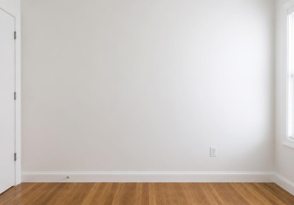 Repaired and freshly painted interior wall after the handyman visit